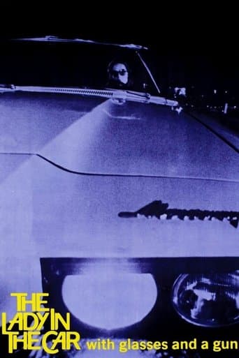 The Lady in the Car with Glasses and a Gun Image