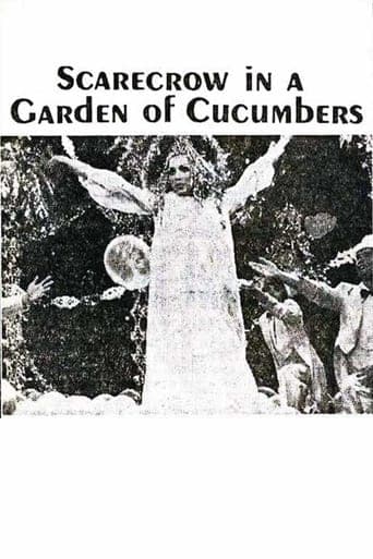 Scarecrow in a Garden of Cucumbers Image